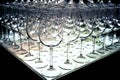 Triangle of empty wine glasses rows for tasting arranged at a wine show.