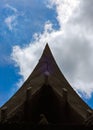 Triangle of in front of Thai roof style with blue sky.