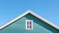 Triangle House Top with a window under the blue sky background. Blue vinyl wooden siding panel on the house Royalty Free Stock Photo