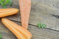 Triangle made of fresh carrots on wooden rustic Royalty Free Stock Photo