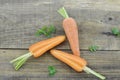 Triangle made of fresh carrots on wooden rustic Royalty Free Stock Photo