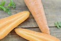 Triangle made of fresh carrots on wooden rustic Royalty Free Stock Photo