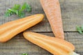 Triangle made of fresh carrots on wooden Royalty Free Stock Photo