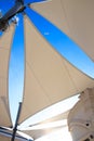 Triangle modern luxury awning with blue sky and sunshine reflect