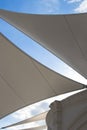 Triangle modern luxury awning with blue sky and sunshine reflection