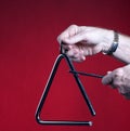 Triangle Played Isolated on Red