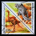 Triangle postage stamp 1997. Protoceratops and struthiomimus dinosaur