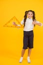 Triangle right angle. Knowledge day. Schoolgirl school uniform hold big ruler geometry school lesson. Math stem Royalty Free Stock Photo