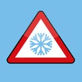 Triangle road sign with snowflake for cold winter