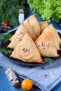 Triangle samsa meat pastry with sesame seeds Royalty Free Stock Photo