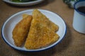 Triangle shape rissole with vegetable or sausage and mayonnaise filling