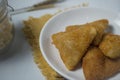 Triangle shape rissole with vegetable or sausage and mayonnaise filling