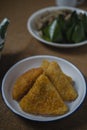 Triangle shape rissole with vegetable or sausage and mayonnaise filling