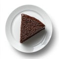 Triangle slice of rich chocolate cake on a white plate indoors Royalty Free Stock Photo