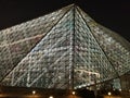 Triangles and lines, architecture modern glass building illuminated at night Royalty Free Stock Photo