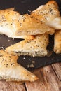 Triangles of phyllo pastry stuffed with chicken, spinach and che