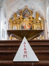 Triangular Alarm Sign in Ornate Church Interior Royalty Free Stock Photo