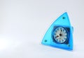 Triangular blue quartz clock alarm clock.