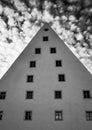 Triangular building against a cloudy sky - monochrome Royalty Free Stock Photo