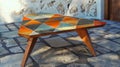 A triangular coffee table with colorful geometric tiles inlaid on its surface Royalty Free Stock Photo