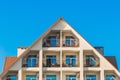 Triangular facade of a modern building interior, a hotel for relaxation in a resort area by the sea against a blue sky Royalty Free Stock Photo