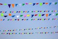 The triangular festive multi-colored flags. Royalty Free Stock Photo