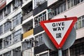 Triangular give way traffic warning board and 2 birds