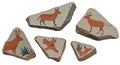 Triangular and irregularly shaped stones feature primitive-style animal paintings in Royalty Free Stock Photo
