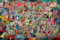 triangular maze of mixed-media geometric shapes in vibrant colors