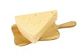 Triangular piece of cheese on cutting board, isolated on white background Royalty Free Stock Photo