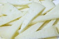 Triangular pieces of sliced of cheese Royalty Free Stock Photo