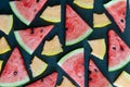 Triangular pieces of water melon spread on black