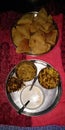 A triangular puri with khir bhujiya is best for breakfast or dinner in madhubani India Royalty Free Stock Photo
