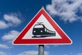 Railroad crossing sign in the blue sky Royalty Free Stock Photo