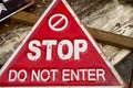 Triangular red sign with STOP Do not enter warning