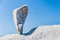 Triangular rock balanced on the tip