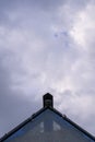 Triangular roof on the sky background