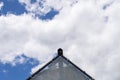 Triangular roof on the sky background