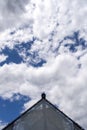 Triangular roof on the sky background