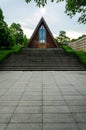 Symmetrical Timber Chapel atop Wide Staircase Framed by Trimmed Hedges and Tiled Plaza Royalty Free Stock Photo