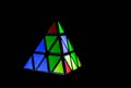 Triangular rubik`s Cube on black background . Royalty Free Stock Photo