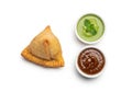 A triangular samosa with a crispy golden-brown exterior is placed Royalty Free Stock Photo