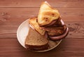 Triangular sandwiches on wooden table