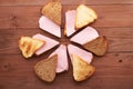 Triangular sandwiches on wooden table