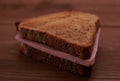 Triangular sandwiches on wooden table