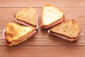 Triangular sandwiches on wooden table