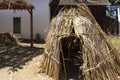 Triangular shape accommodation made of straws in a hot environment. Teepee hut popular in traditional culture among tribes Royalty Free Stock Photo