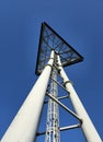 Triangular sign on a big three leg steel pole