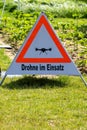 A triangular sign with a drone on it Royalty Free Stock Photo