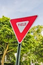 Triangular Sign in Red and White Means Yield